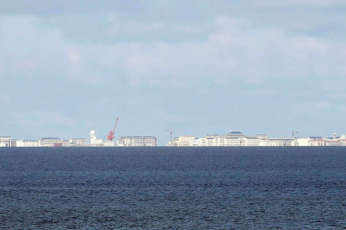 FILE PHOTO: Chinese structures are pictured in Subi Reef in disputed South China Sea, April 21, 2017. REUTERS/Erik De Castro/File Photo