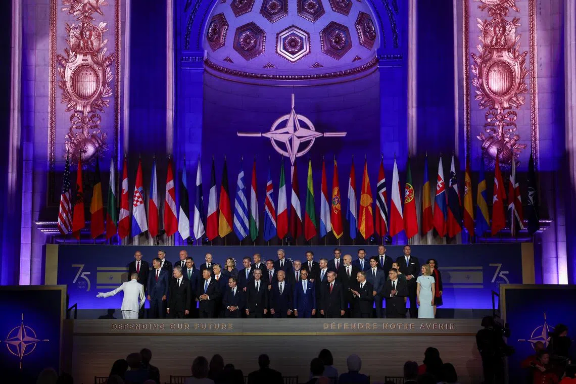 Canadian Prime Minister Justin Trudeau, Italian Prime Minister Giorgia Meloni, Sweden's Prime Minister Ulf Kristersson, The Netherlands' Former Prime Minister Mark Rutte, NATO Secretary General Jens Stoltenberg, U.S. President Joe Biden, Turkish President Tayyip Erdogan, Polish President Andrzej Duda, Czech Republic's President Petr Pavel, Hungary's Prime Minister Viktor Orban, Estonia's Prime Minister Kaja Kallas, the Norwegian Prime Minister Jonas Gahr Store, Greek Prime Minister Kyriakos Mitsotakis, German Chancellor Olaf Scholz, Spanish Prime Minister Pedro Sanchez, Latvia's President Edgars Rinkevics and other officials pose for a family photo as they attend a NATO event to commemorate the 75th anniversary of the alliance, in Washington, U.S., July 9, 2024. REUTERS/Yves Herman