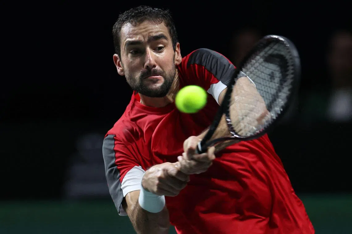 Croatia's Marin Cilic returning the ball to Spain’s Pablo Carreno Busta during the Davis Cup men's single quarter-final on Wednesday (Nov 23). 