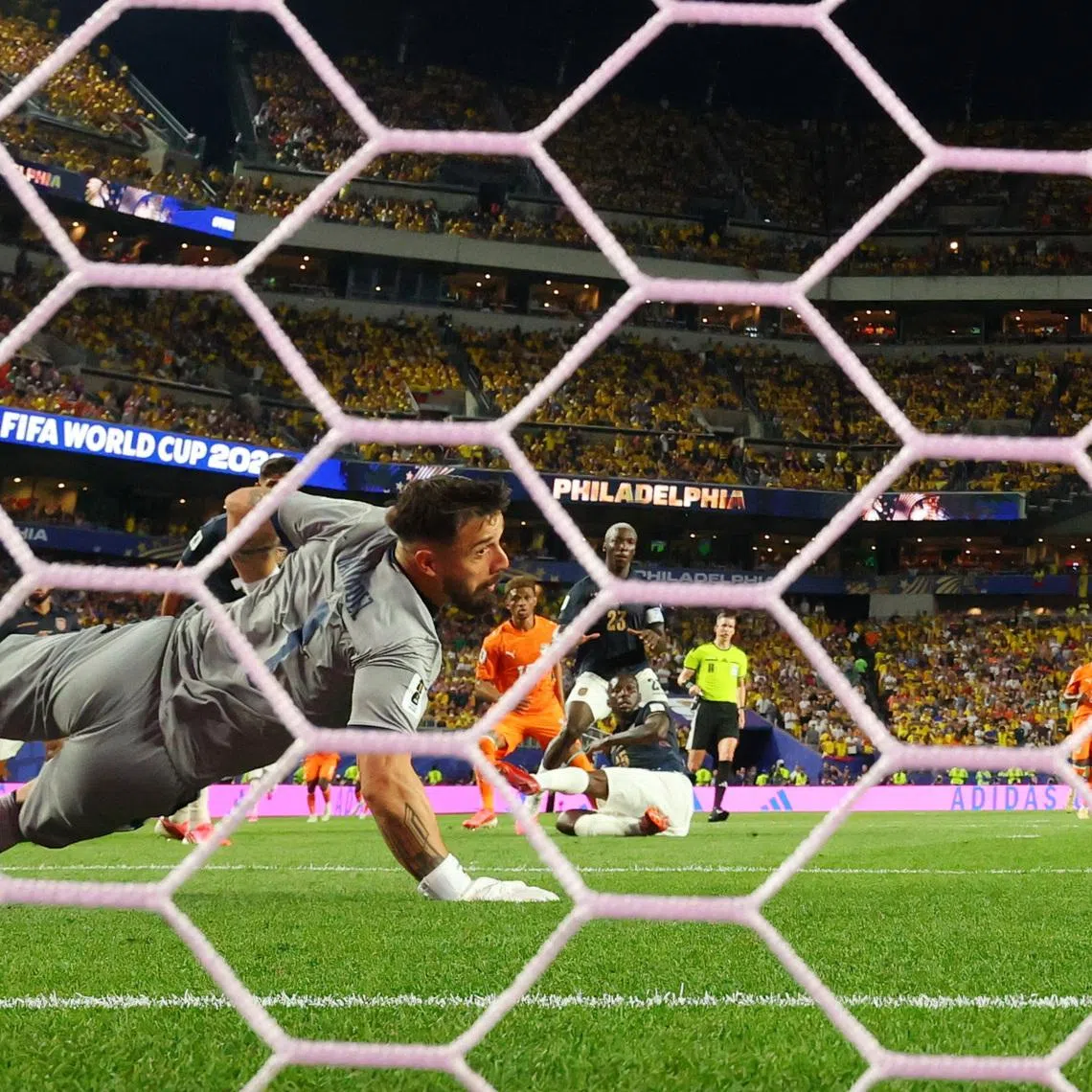 Soccer Football - FIFA World Cup 2026 - Group E - Ivory Coast v Ecuador - Philadelphia Stadium, Philadelphia, Pennsylvania, U.S. - June 14, 2026 Ivory Coast's Amad Diallo scores their first goal past Ecuador's Hernan Galindez REUTERS/Mike Segar