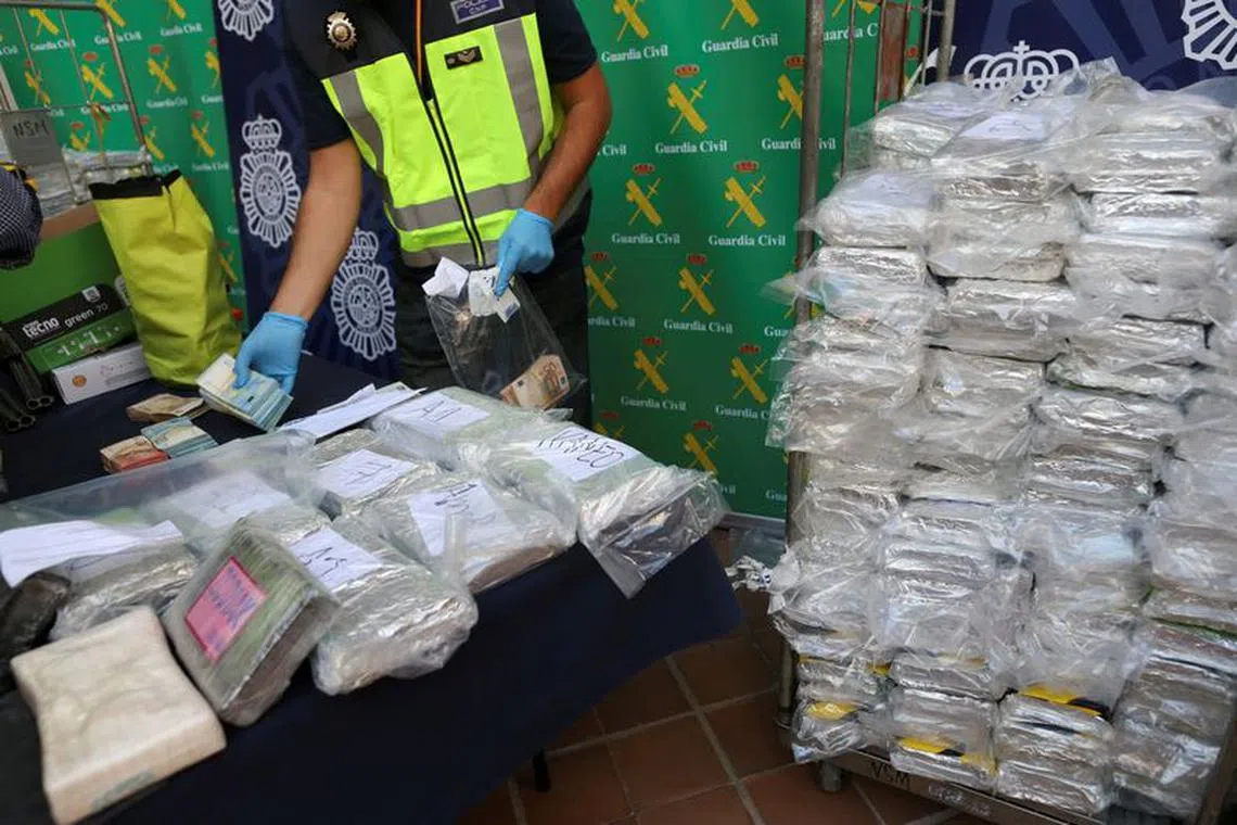 FILE PHOTO: Police display a portion of the six tonnes of cocaine, money and other material which was seized during a drug bust at an industrial estate at the police headquarters in Malaga, Spain, October 25, 2018.  REUTERS/Jon Nazca/File Photo