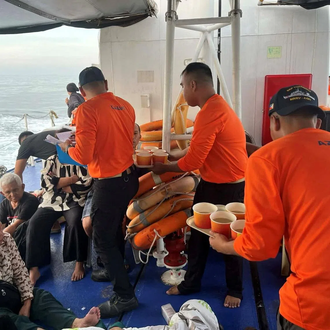 Philippine Coast Guard personnel assist survivors who were aboard the MV Trisha Kerstin 3, which capsized around the waters of Baluk-baluk Island, Basilan, Philippines, January 26, 2026. Philippine Coast Guard/Handout via REUTERS    THIS IMAGE HAS BEEN SUPPLIED BY A THIRD PARTY