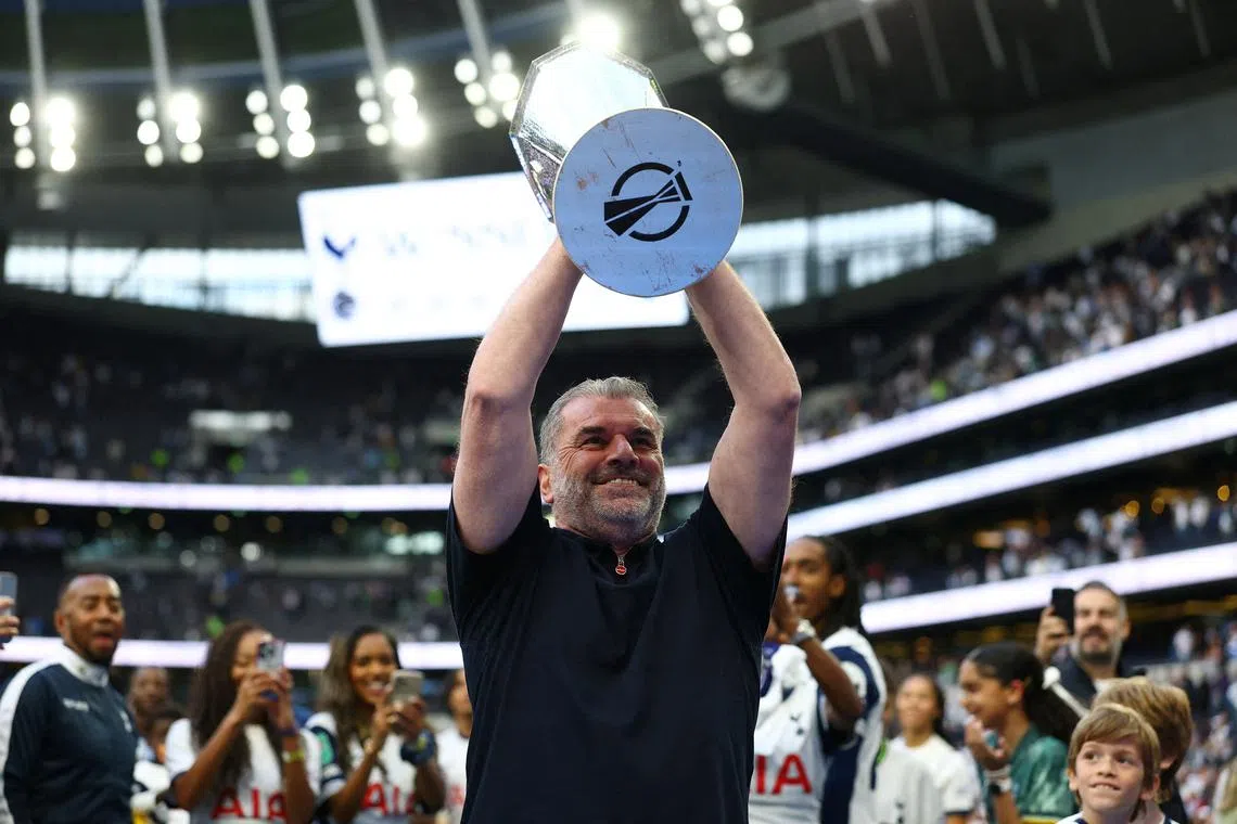 FILE PHOTO: Soccer Football - Premier League - Tottenham Hotspur v Brighton & Hove Albion - Tottenham Hotspur Stadium, London, Britain - May 25, 2025, Tottenham Hotspur manager Ange Postecoglou holds aloft the Europa League trophy during a lap of appreciation after the match Action Images via Reuters/Matthew Childs/File Photo