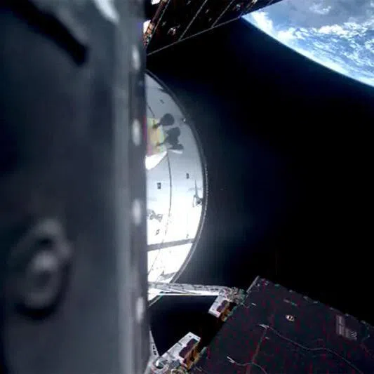 The Artemis II mission's Orion capsule leaves Earth on its way to fly by the moon, on April 1, in a still image from video.