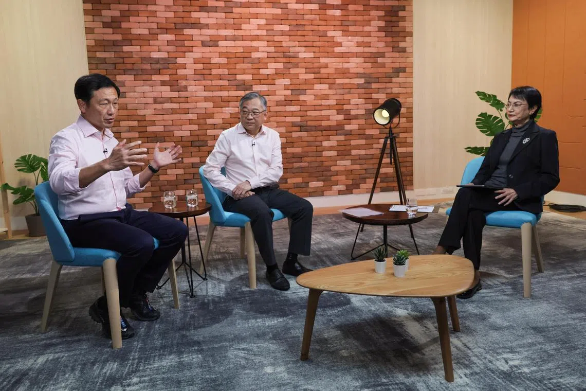 ST20241227_202464800572: Gin Tay/ skfinance / Salma Khalik/
The Straits Times Senior Health Correspondent, Salma Khalik (right) in a discussion with (from left): Health Minister Ong Ye Kung and DPM Gan Kim Yong about the Healthcare finance package at News Centre, Studio 65 on Dec 27, 2024.