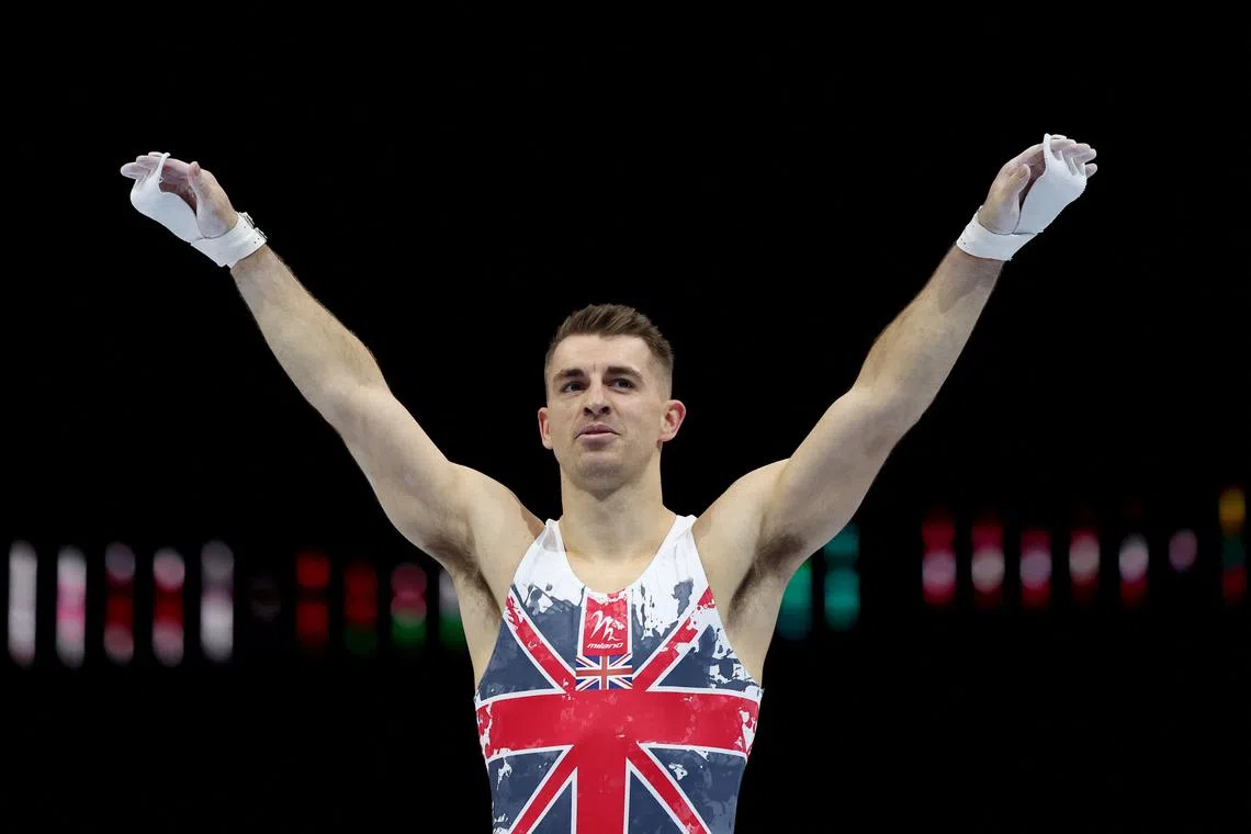 FILE PHOTO: Gymnastics - 2023 World Artistic Gymnastics Championships - Sportpaleis, Antwerp, Belgium - September 30, 2023 Britain's Max Whitlock reacts after his routine on the horizontal bar during the men's qualification REUTERS/Yves Herman/File Photo