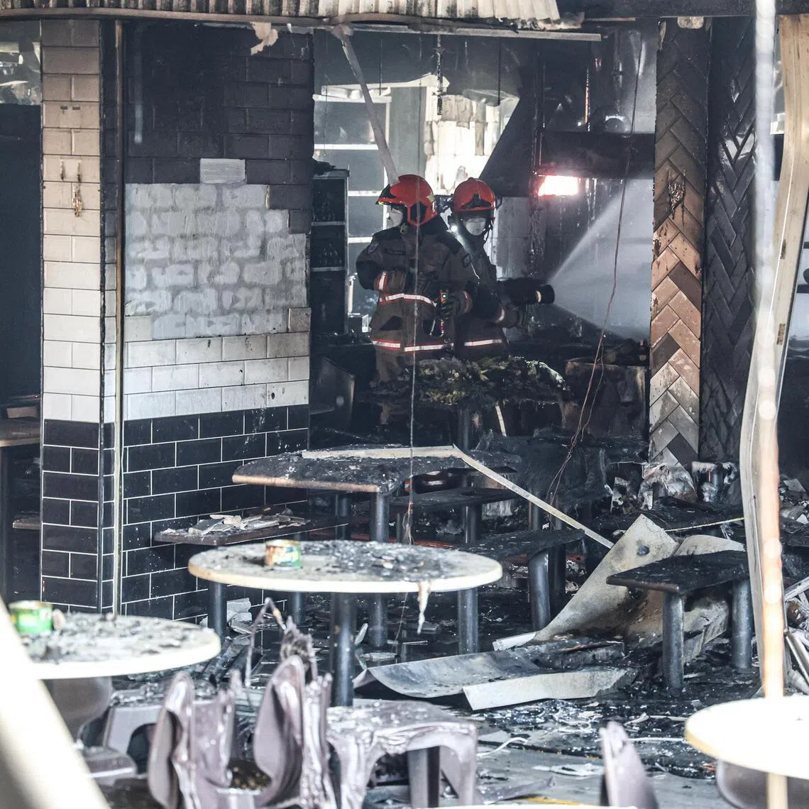Several stalls in a coffee shop at Block 106 Hougang Avenue 1 caught fire early on May 5.