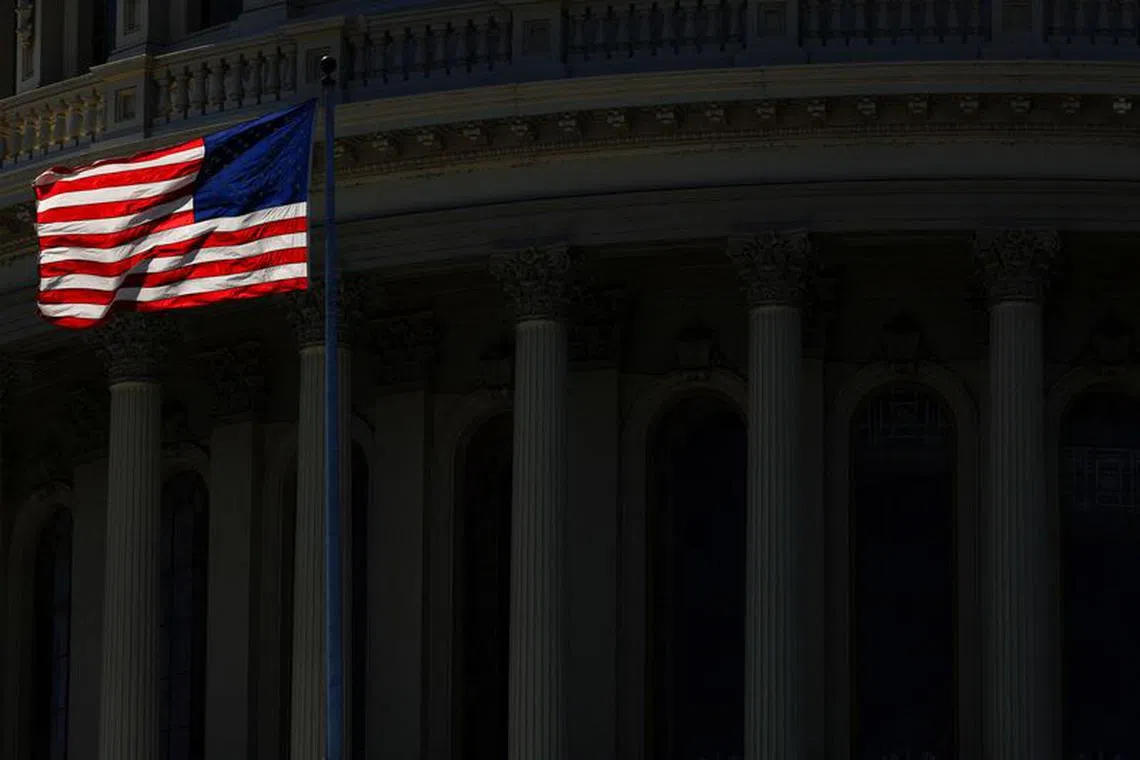 An American Flag on the U.S. Capitol Building is seen in Washington, U.S., August 31, 2023. REUTERS/Kevin Wurm/ File Photo