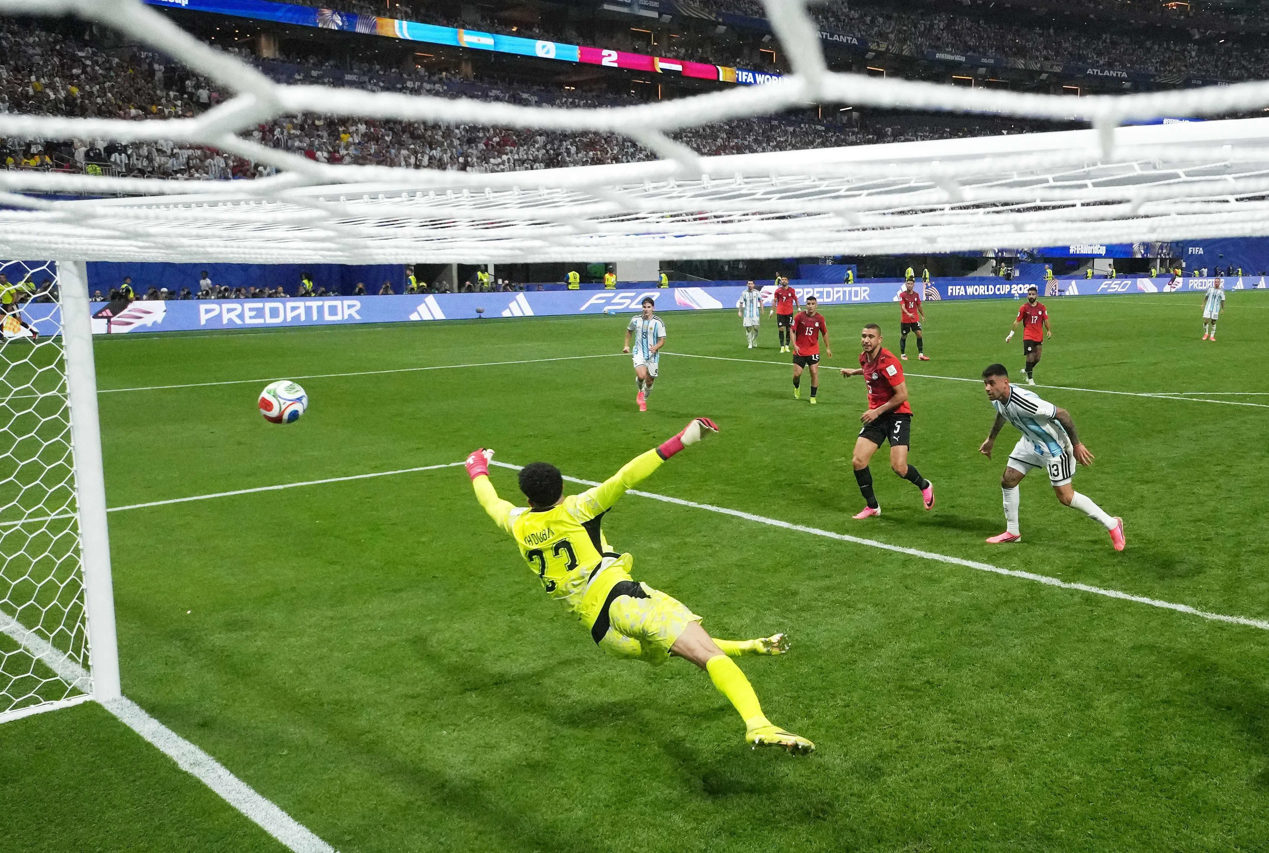 ATLANTA, GEORGIA - JULY 07: (EDITORS NOTE: Image was captured using a remote netcam) Cristian Romero #13 of Argentina heads to score the team's first goal past Mostafa Shoubir #23 of Egypt during the FIFA World Cup 2026 Round of 16 match between Argentina and Egypt at Atlanta Stadium on July 07, 2026 in Atlanta, Georgia.   Elsa/Getty Images/AFP (Photo by ELSA / GETTY IMAGES NORTH AMERICA / Getty Images via AFP)