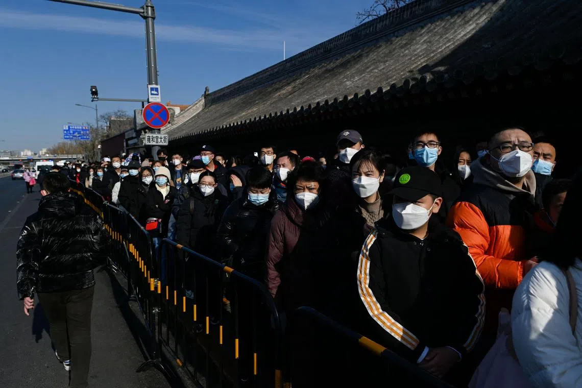 People queueing to visit Yonghe temple on the first day of the new year in Beijing on Jan 1, 2023. 