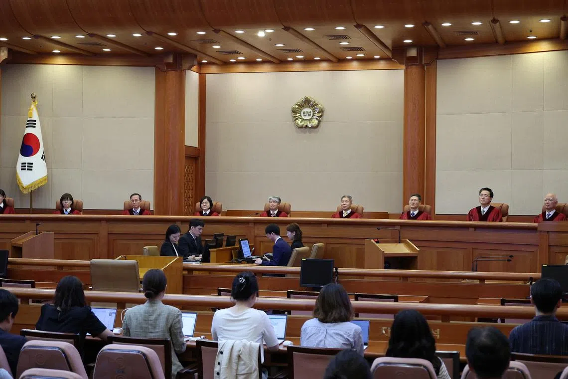 Chief of Constitutional Court Lee Jong-seok and other justices arrive at the Constitutional Court in Seoul, South Korea, August 29, 2024.   REUTERS/Kim Hong-Ji