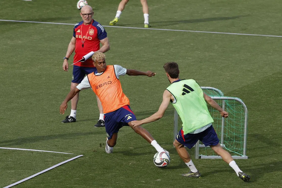 Spain coach Luis de la Fuente oversees a training session ahead of their Nations League semi-final clash with France.