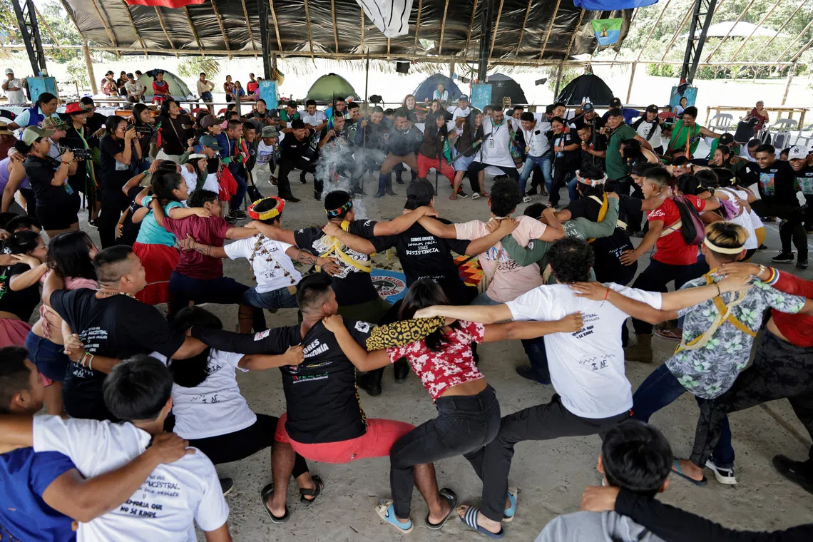 Indigenous guards participate in a recreational activity during a meeting of guards from communities across the region, who aim to defend the natural resources of the Amazon from exploitation, in Sinangoe, Ecuador, December 3, 2025. REUTERS/Karen Toro