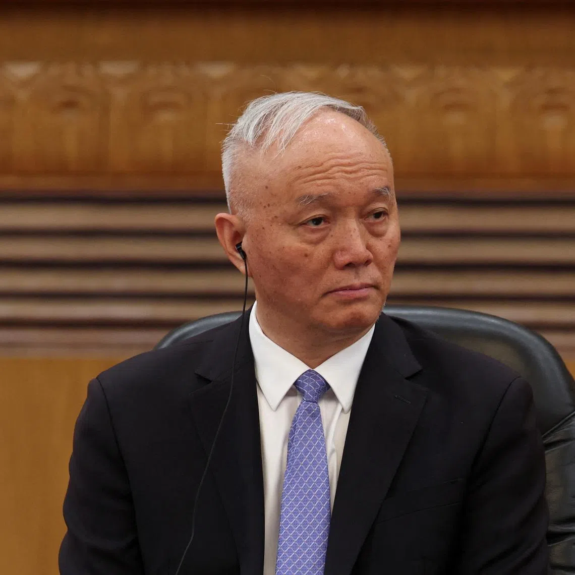 Chinese Politburo Standing Committee member Cai Qi attends a meeting with global business leaders at the Great Hall of the People in Beijing, China, March 28, 2025. REUTERS/Florence Lo