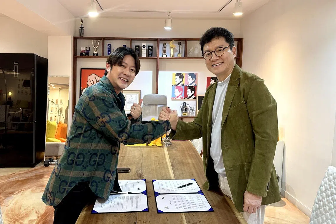 Evergreen Holdings' CEO David Yong (left) and Attrakt's CEO Jeon Hong-jung (right) signed a memorandum of understanding (MOU) on Aug 25, 2023 where Evergreen will invest 10 billion won (S$10.2 million) into K-pop entertainment agency Attrakt. 