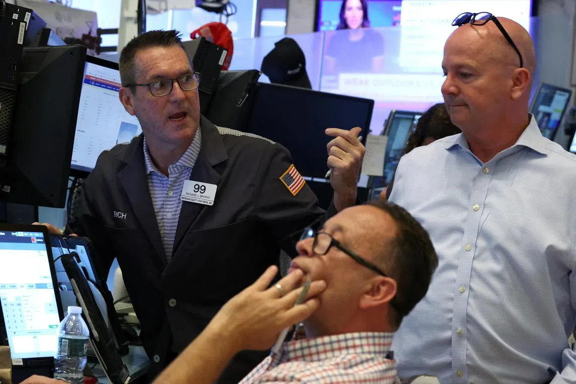 Traders working on the floor of the New York Stock Exchange, in New York City, on Aug 14.