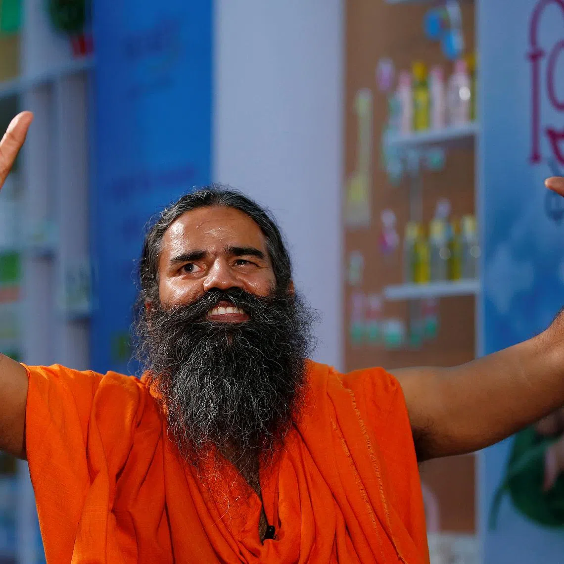 FILE PHOTO: Indian yoga guru Baba Ramdev gestures as talks to media after a news conference in New Delhi, India, May 4, 2017. To match Special Report INDIA-MODI/RAMDEV REUTERS/Adnan Abidi/File Photo