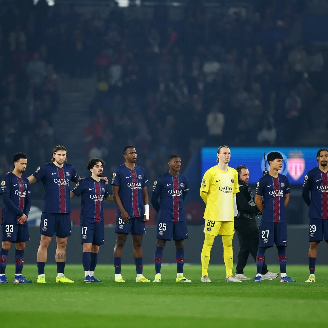 Soccer Football - Ligue 1 - Paris St Germain v AS Monaco - Parc des Princes, Paris, France - March 6, 2026 Paris St Germain players line up during a minute silence for the late Jack Jacquet before the start of the match REUTERS/Abdul Saboor