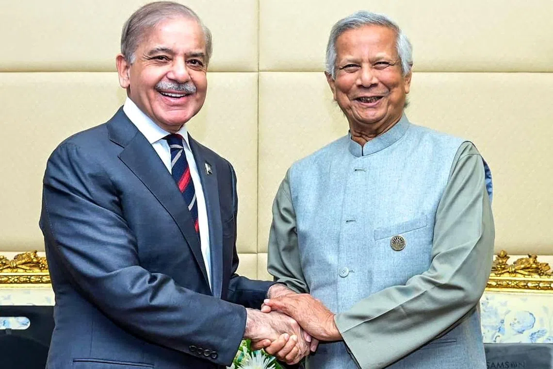 In this handout photo released by Pakistan’s Press Information Department (PID), Pakistan’s Prime Minister Shehbaz Sharif (L) shakes hands with Bangladesh’s interim leader Muhammad Yunus during a bilateral meeting on the sidelines of the D-8 summit in Cairo on December 19, 2024. (Photo by Pakistan's Press Information Department (PID) / AFP) / XGTY / RESTRICTED TO EDITORIAL USE - MANDATORY CREDIT "AFP PHOTO/Pakistan's Press Information Department (PID)" - NO MARKETING NO ADVERTISING CAMPAIGNS - DISTRIBUTED AS A SERVICE TO CLIENTS
