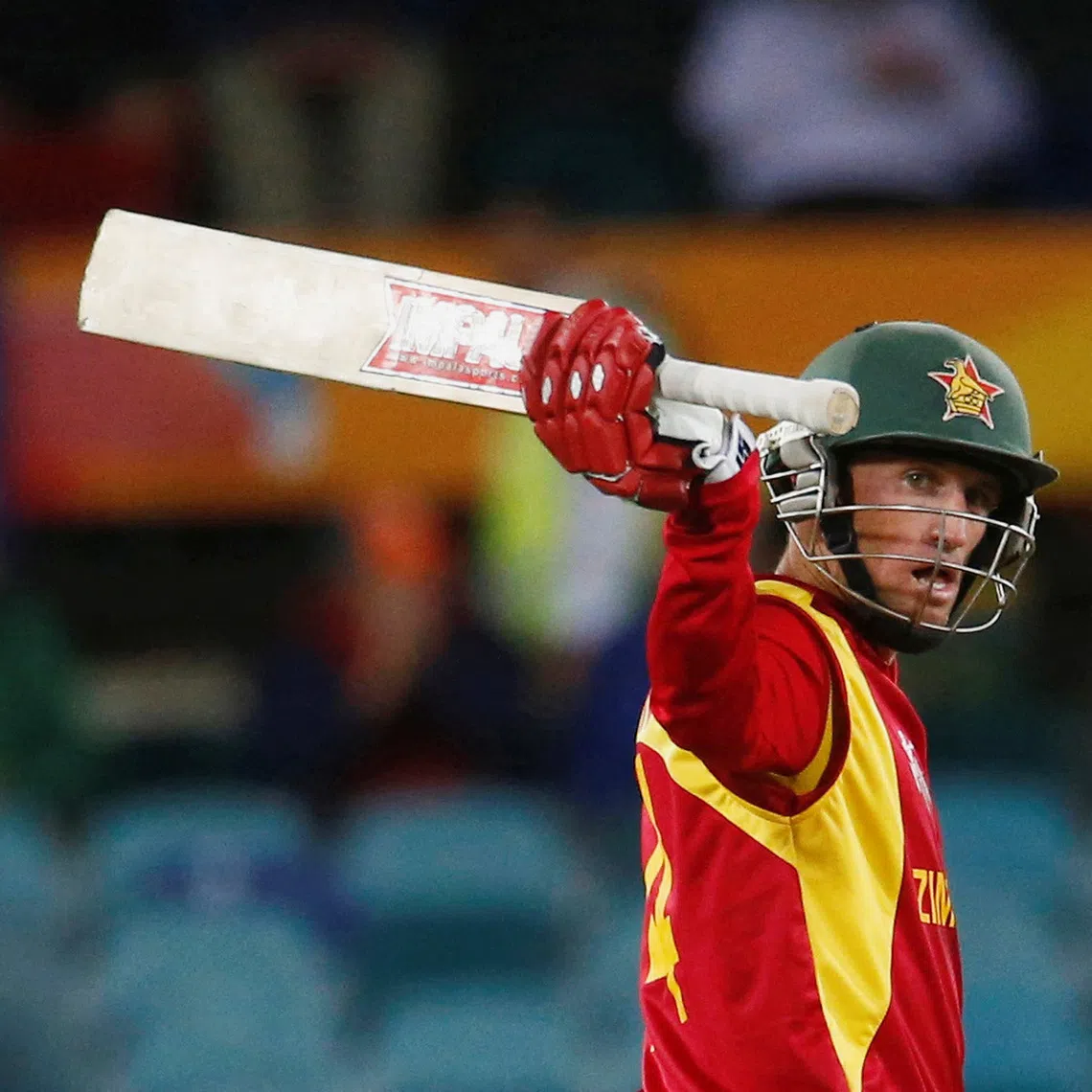 FILE PHOTO: Zimbabwe's batsman Sean Williams acknowledges his 50 runs during his World Cup Cricket match against the West Indies in Canberra, February 24, 2015.    REUTERS/David Gray/File Photo