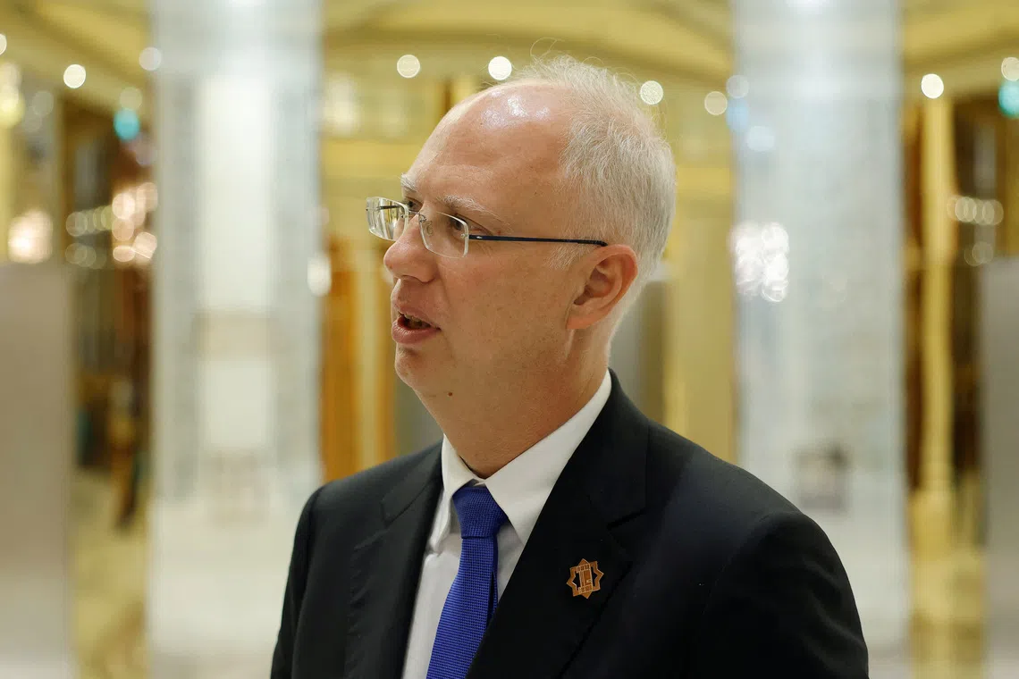 The head of Russia's sovereign wealth fund Kirill Dmitriev speaks to members of the delegation and journalists after the U.S.-Russia talks in Riyadh, Saudi Arabia, February 18, 2025. REUTERS/Maxim Shemetov