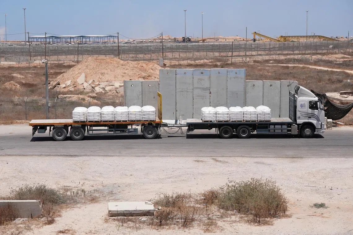 A truck carrying aid for delivery into Gaza drives through the Kerem Shalom crossing in southern Israel,  June 17, 2024. REUTERS/Nathan Frandino/ File Photo