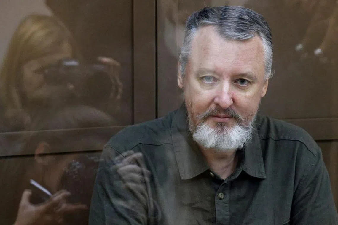 FILE PHOTO: Russian nationalist Kremlin critic and former military commander Igor Girkin, also known as Igor Strelkov, who is charged with inciting extremist activity, sits behind a glass wall of an enclosure for defendants during a court hearing to consider an appeal against his detention, in Moscow, Russia August 29, 2023. REUTERS/Maxim Shemetov/File Photo