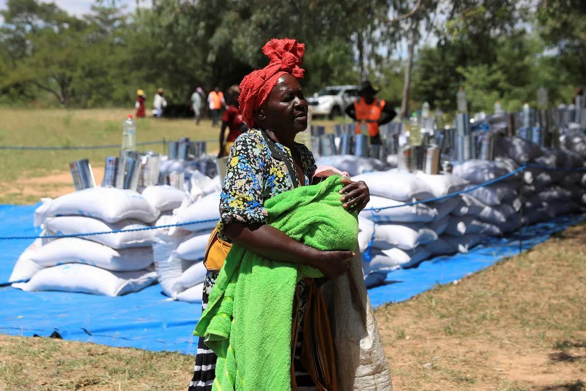FILE PHOTO: A villager arrives to collect her monthly allocations of food aid provided by the World Food Program (WFP) in Mumijo, Buhera district east of the capital Harare, Zimbabwe, March 16, 2024. REUTERS/Philimon Bulawayo/File Photo