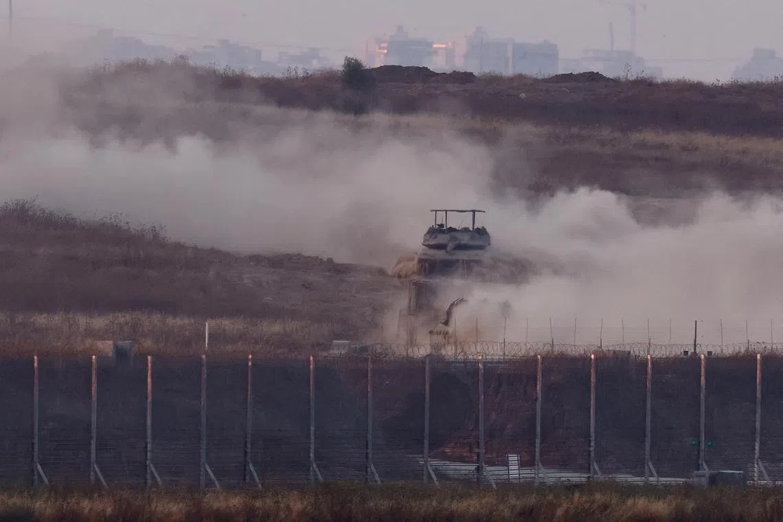 An Israeli tank manoeuvres inside Gaza, amid the ongoing conflict between Israel and the Palestinian Islamist group Hamas, as seen from Israel, May 28, 2024. REUTERS/Amir Cohen
