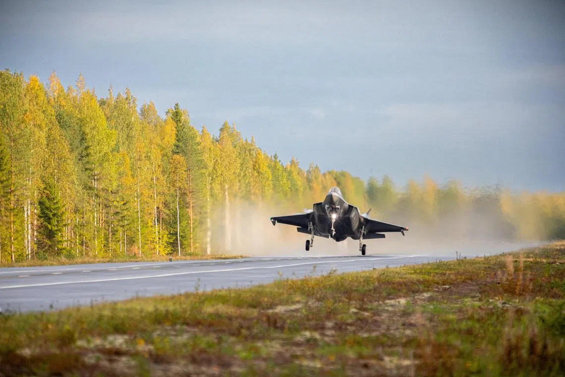 An F-35A Lockheed Martin fighter jet landing on a motorway, in Finland in 2023.