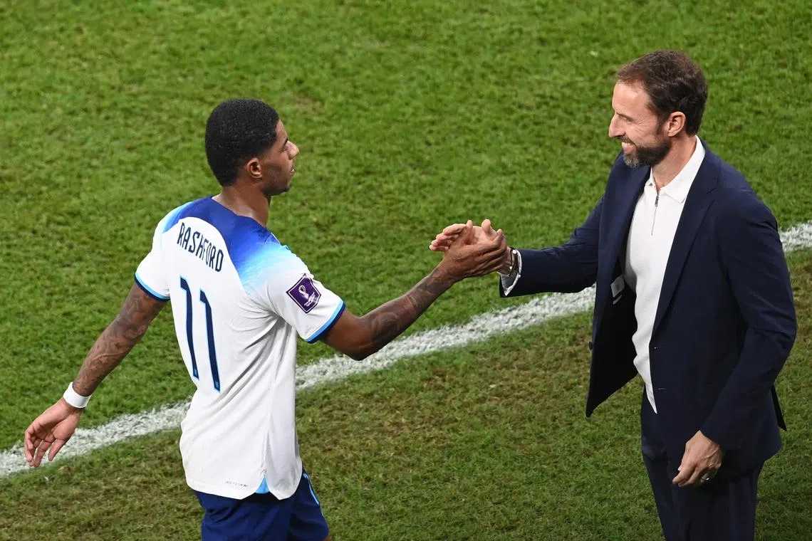 England forward Marcus Rashford and coach Gareth Southgate during the 3-0 World Cup win over Wales on Nov 29, 2022.