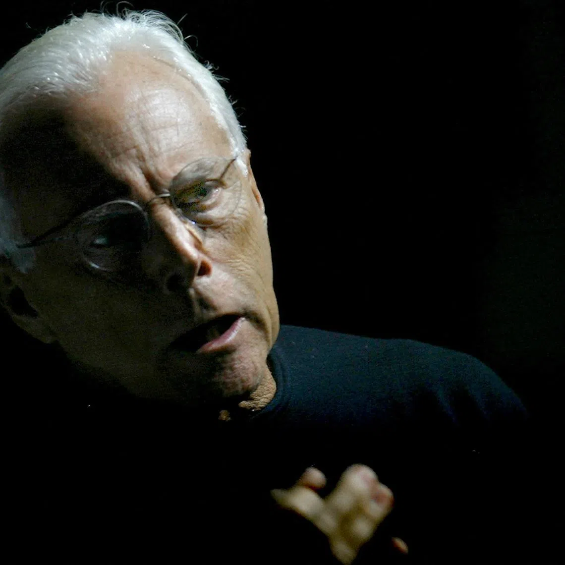 FILE PHOTO: Italian designer Giorgio Armani gestures before the start of his Autumn/Winter 2004 women's collection during Milan Fashion Week, Italy, February 23, 2004. REUTERS/Alessandro Bianchi/File Photo