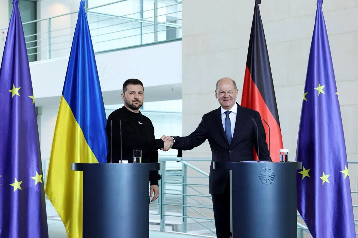 Ukrainian President Volodymyr Zelensky (left) was in Berlin earlier on Sunday to meet with German Chancellor Olaf Scholz (right).