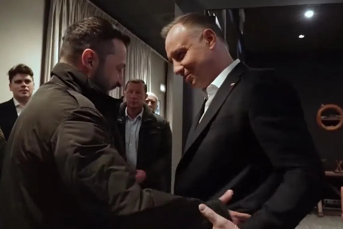 Ukrainian President Volodymyr Zelensky (left) is welcomed by Polish president Andrzej Duda.