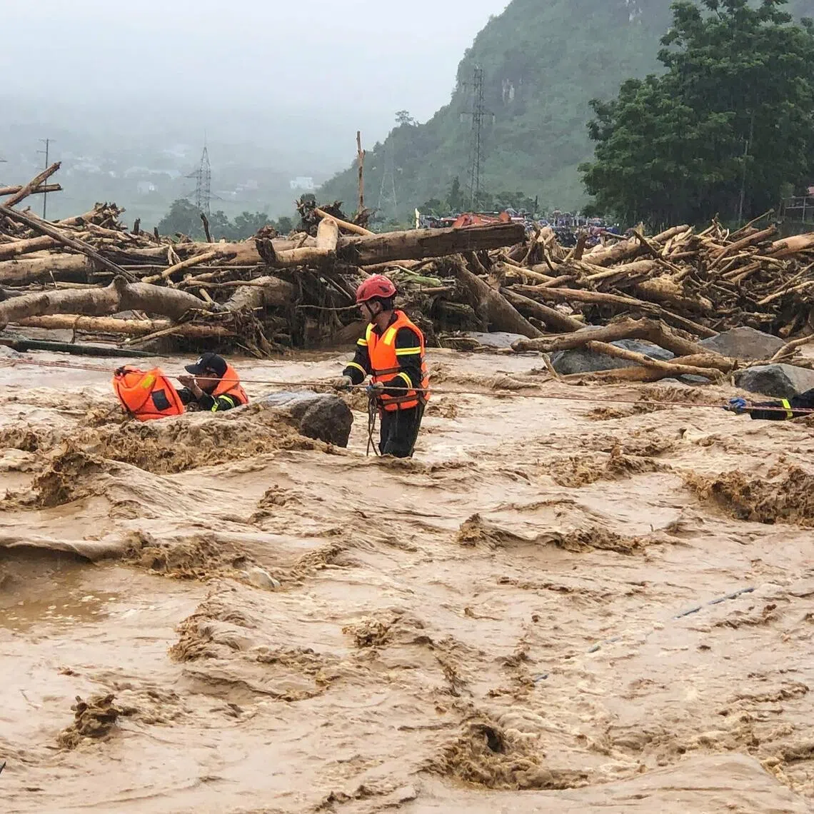 Rescue workers battling flash floods in Muong Than village, Lai Chau province, northern Vietnam.