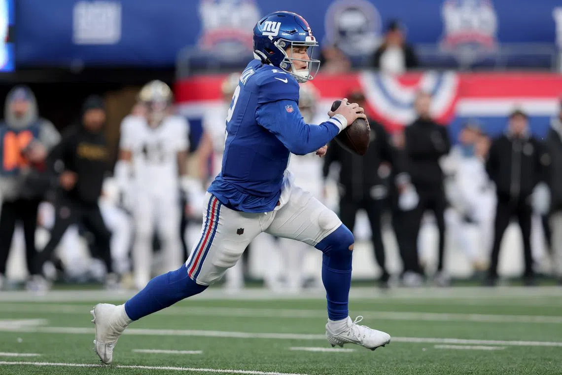 Dec 8, 2024; East Rutherford, New Jersey, USA; New York Giants quarterback Drew Lock (2) runs with the ball against the New Orleans Saints during the fourth quarter at MetLife Stadium. Brad Penner-Imagn Images/File Photo