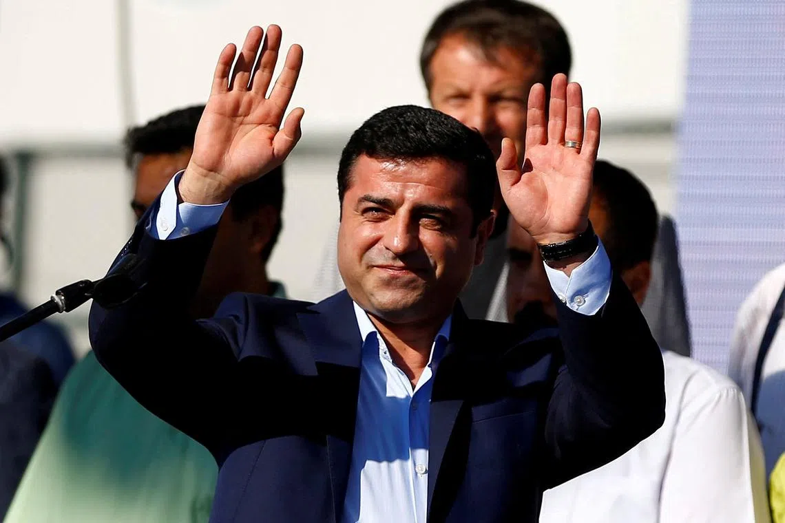 FILE PHOTO: Selahattin Demirtas, co-leader of the pro-Kurdish Peoples' Democratic Party (HDP), greets the crowd during a peace rally to protest against Turkish military operations in northern Syria, in Istanbul, Turkey, September 4, 2016. REUTERS/Osman Orsal/File Photo