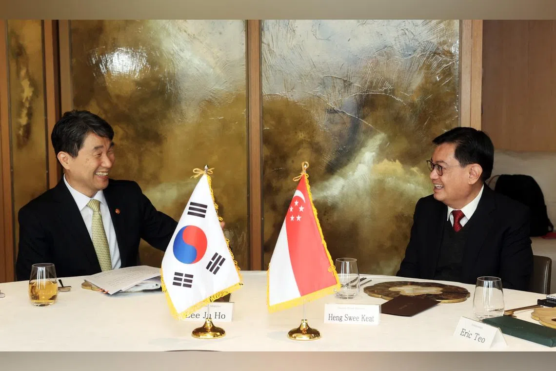 DPM Heng Swee Keat (right) meeting his South Korean counterpart, Dr Lee Ju-ho, during his working visit in Seoul on Nov 19.