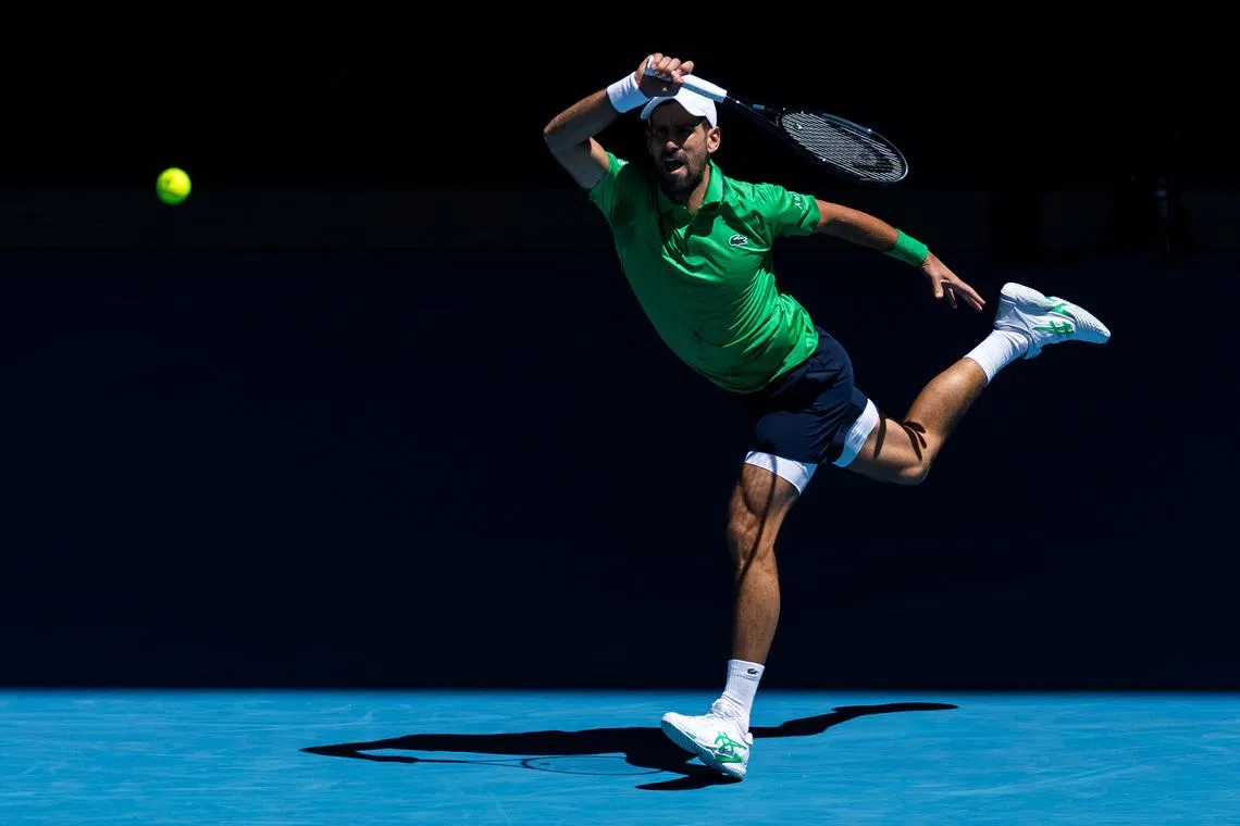 Jan 22, 2026; Melbourne, Victoria, Australia; Novak Djokovic of Serbia in action against Francesco Maestrelli of Italy in the second round of the men’s singles at the Australian Open at Rod Laver Arena in Melbourne Park. Mandatory Credit: Mike Frey-Imagn Images