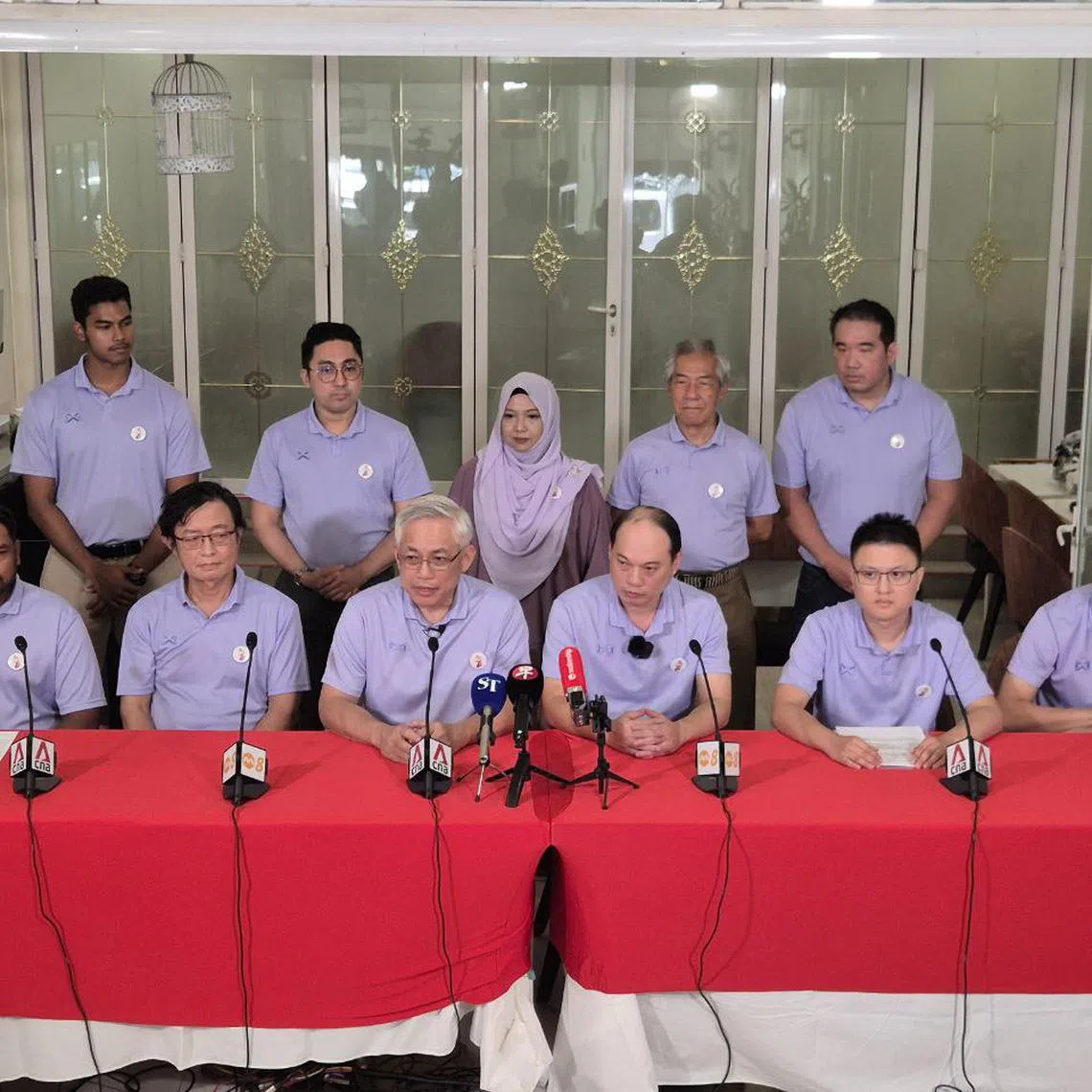 People's Power Party secretary-general Goh Meng Seng (front row, third from left) and his team members speaking at a press conference on April 22. 