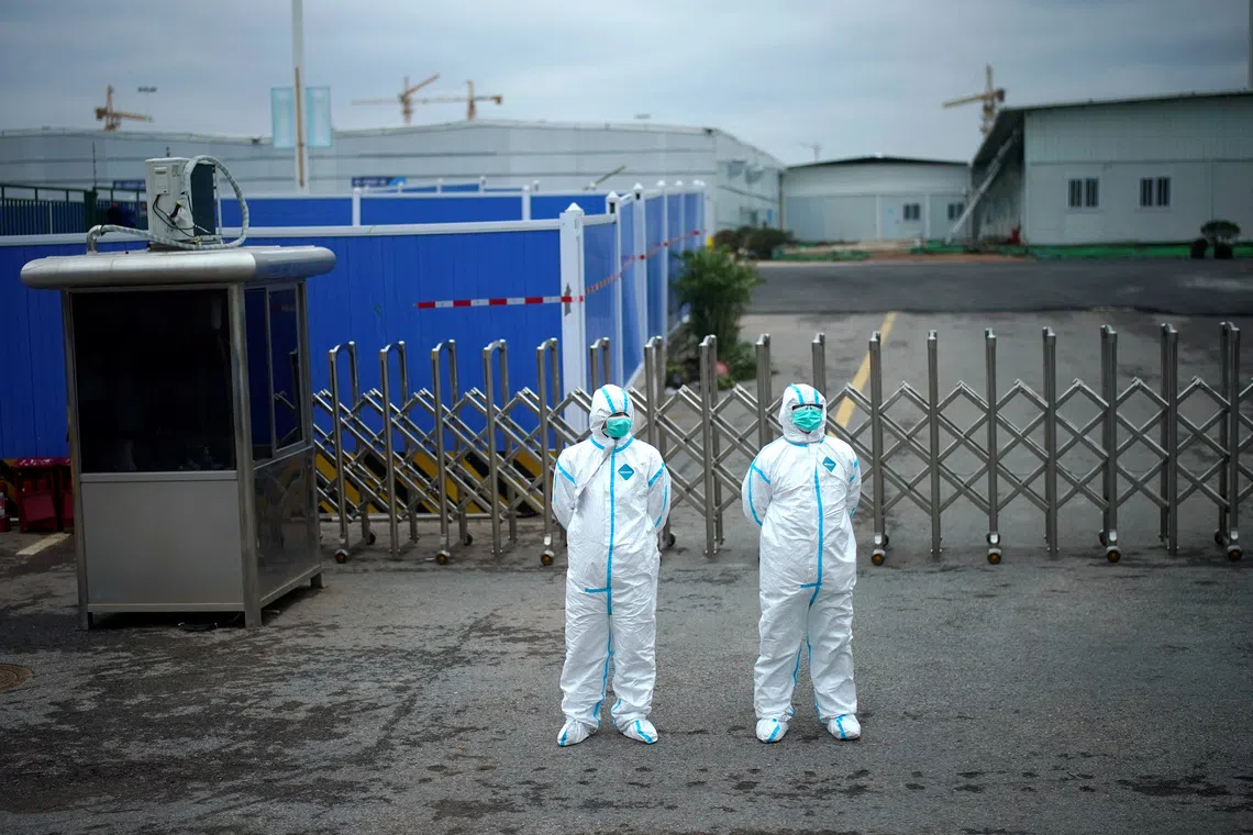 FILE PHOTO: Workers in protective suits are seen at the Leishenshan Hospital, a makeshift hospital for treating patients with the coronavirus disease (COVID-19), in Wuhan, Hubei province, China April 11, 2020. REUTERS/Aly Song/File Photo