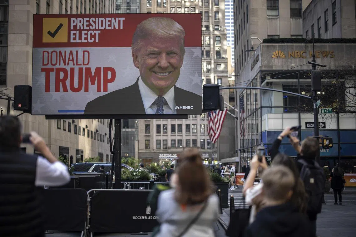 People watching a broadcast of the presidential election results, at Rockefeller Plaza in New York, on Nov 6.