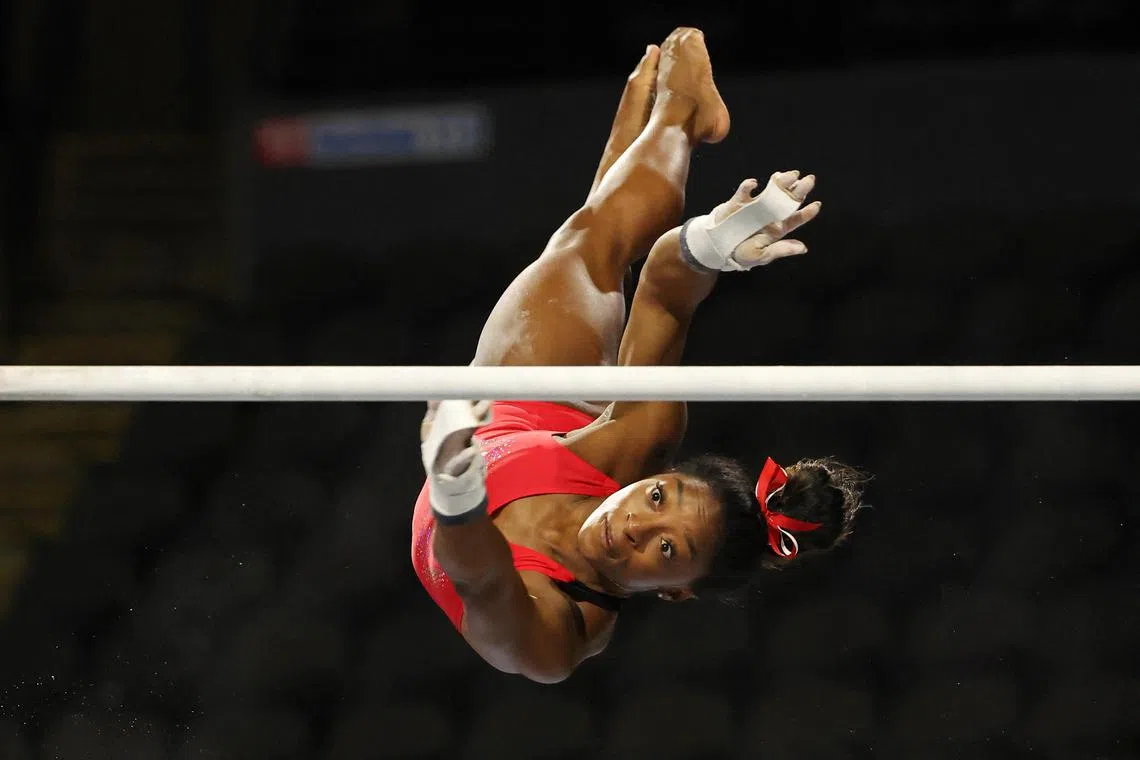 Simone Biles practices on the uneven bars ahead of the Core Hydration US Classic.
