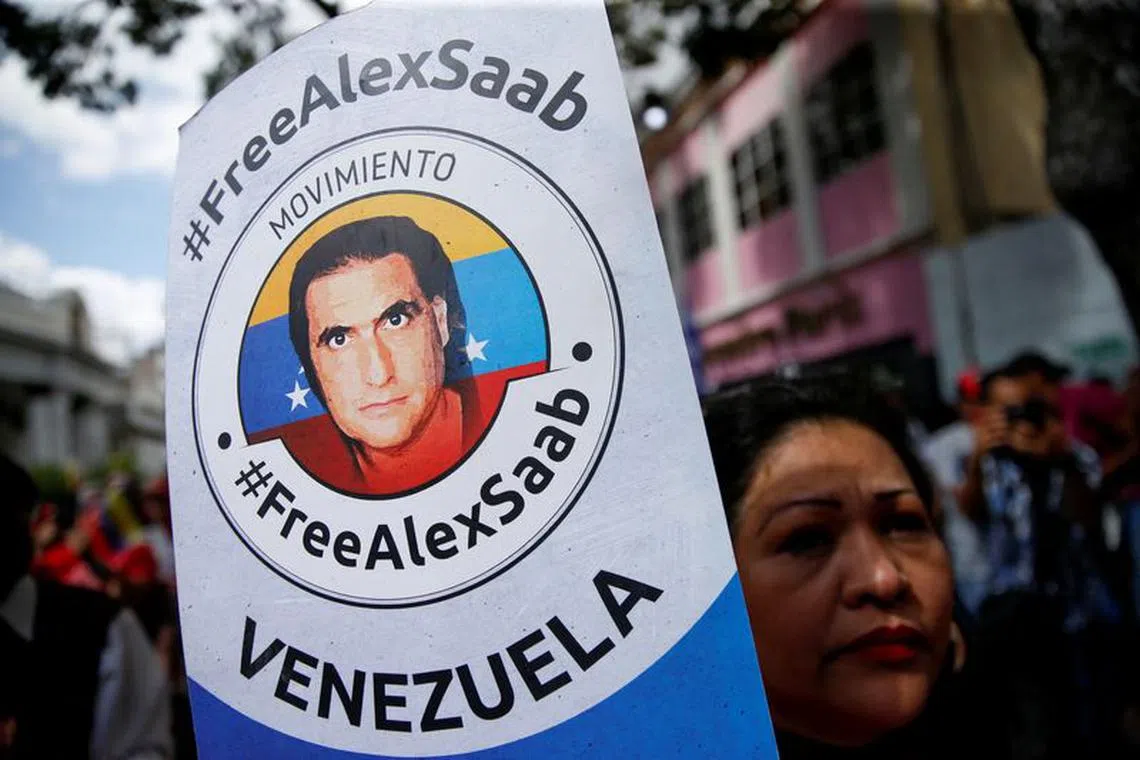 A demonstrator of the \"Free Alex Saab\" movement participates in a rally in front of the National Assembly of Venezuela demanding the release of Saab, a Colombian businessman with Venezuelan ties who was extradited to the U.S. on a charge of money laundering, in Caracas, Venezuela December 16, 2022. REUTERS/Leonardo Fernandez Viloria/File Photo