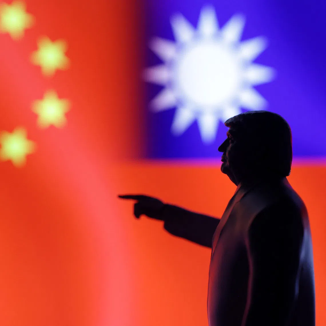 A 3D-printed miniature model depicting U.S. President Donald Trump, Chinese flag and fragment of Taiwanese flag in this illustration taken,  April 17, 2025. REUTERS/Dado Ruvic/Illustration