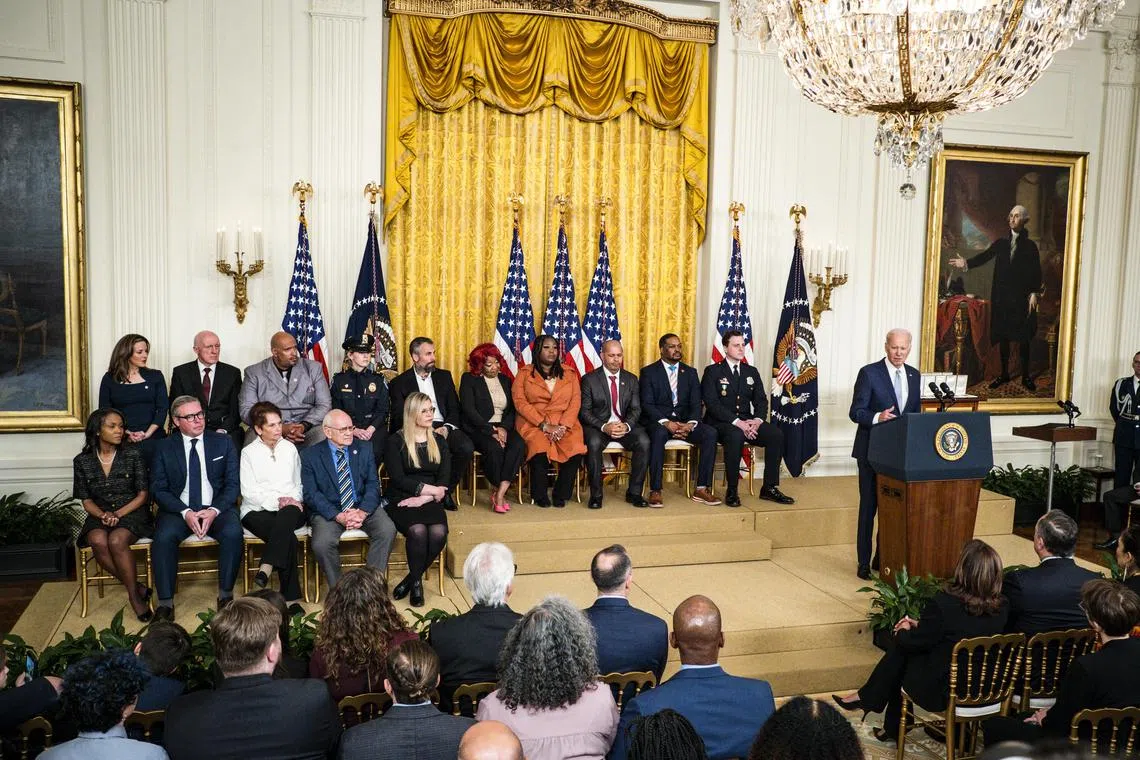 US President Joe Biden delivers remarks during a White House event to mark the second anniversary of the Jan 6 attack on the Capitol, in Washington.