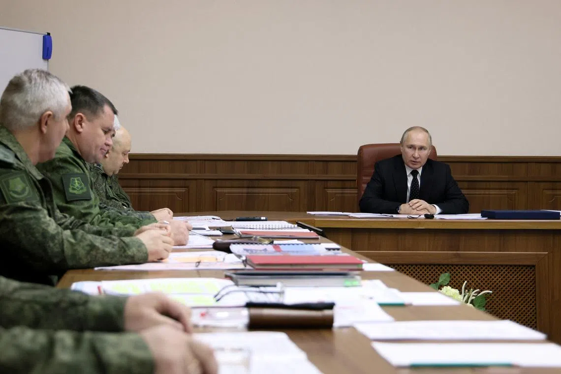 Russian President Vladimir Putin meeting military top brass to discuss the Ukraine war on Saturday.