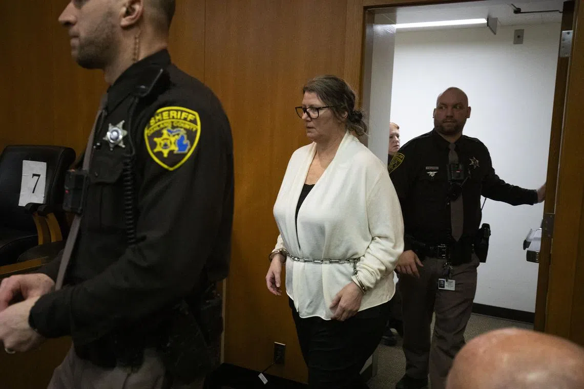 Jennifer Crumbley enters a court room at Oakland County Circuit Court before jury deliberations begin in her trial.