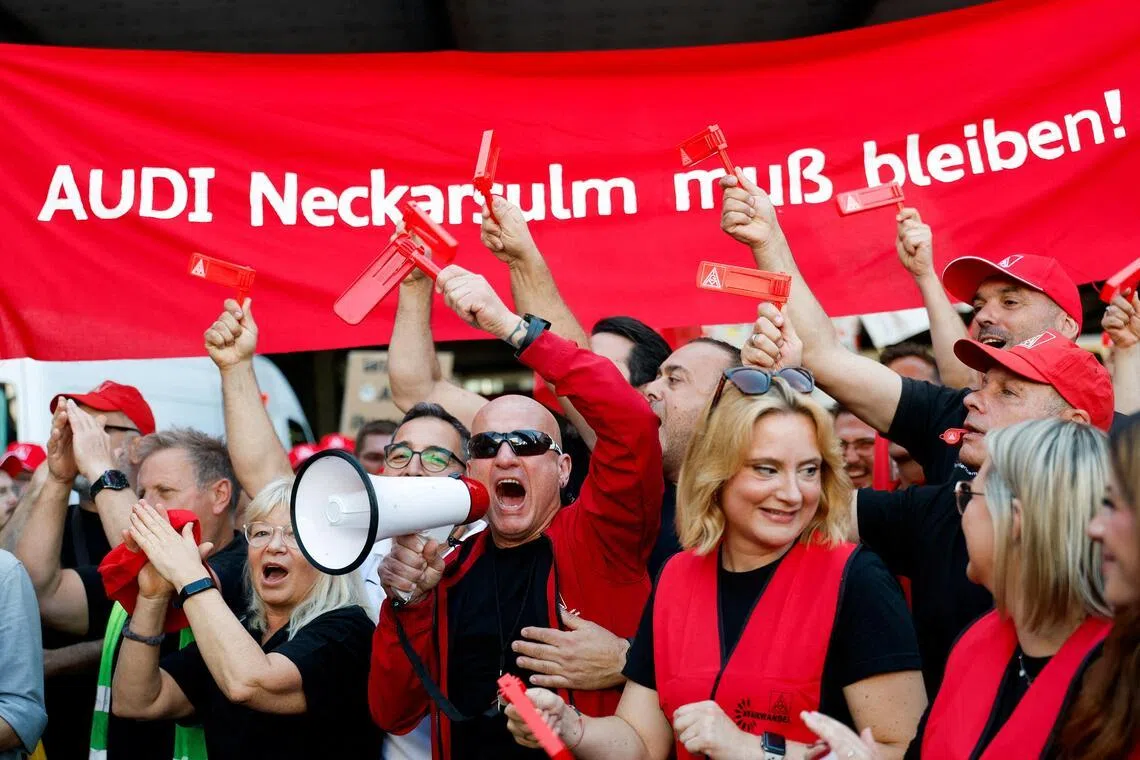 Workers gather to protest at Audi's car plant, one of the facilities threatened with possible closure as part of restructuring plans by parent company Volkswagen in Neckarsulm, Germany, July 29, 2026.