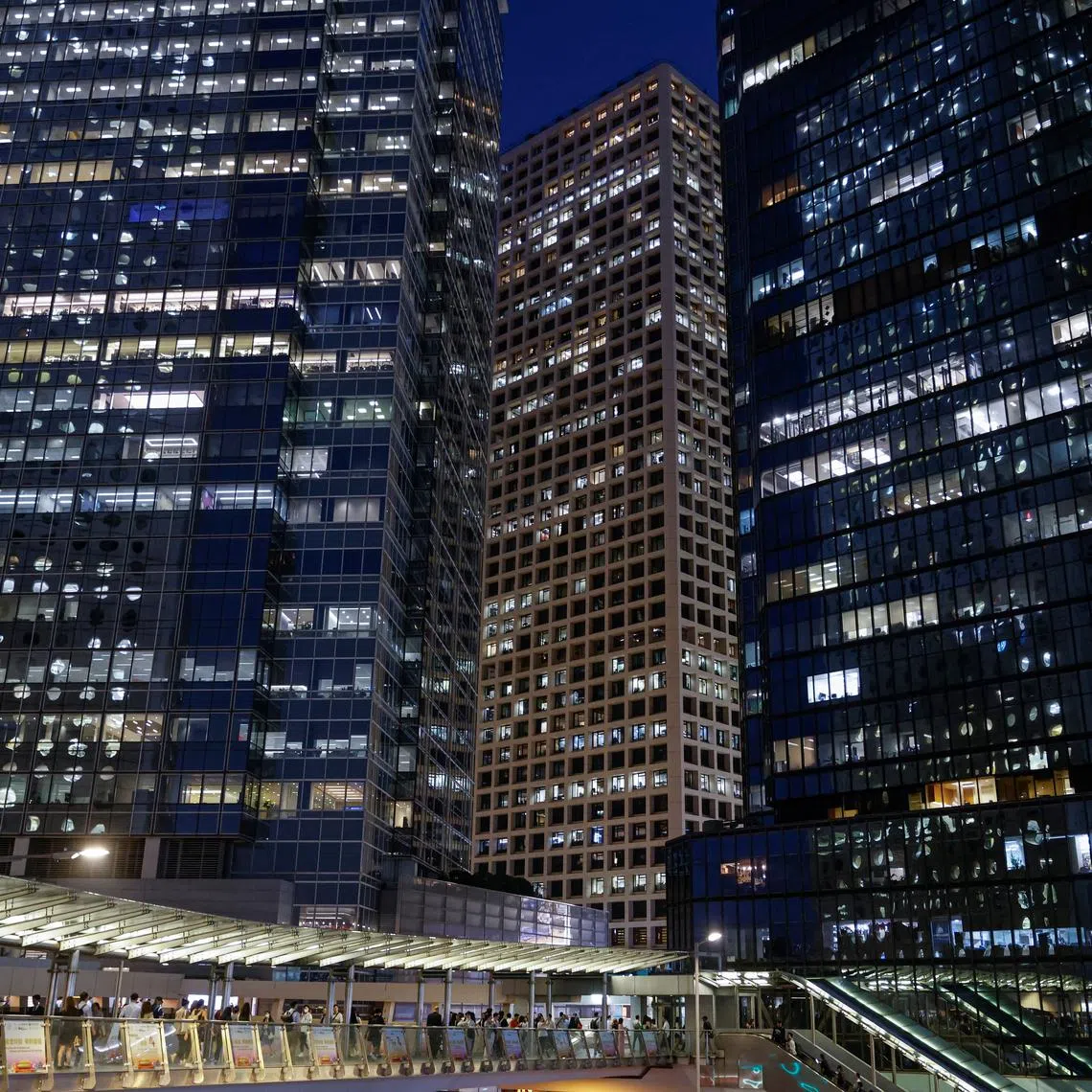 FILE PHOTO: An evening view of the financial central district of Hong Kong, China October 3, 2023. REUTERS/Tyrone Siu/File Photo